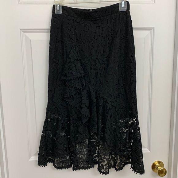 DO BE Size Small lace sexy black skirt.  Mini skirt lining with lace ruffle - Picture 1 of 8